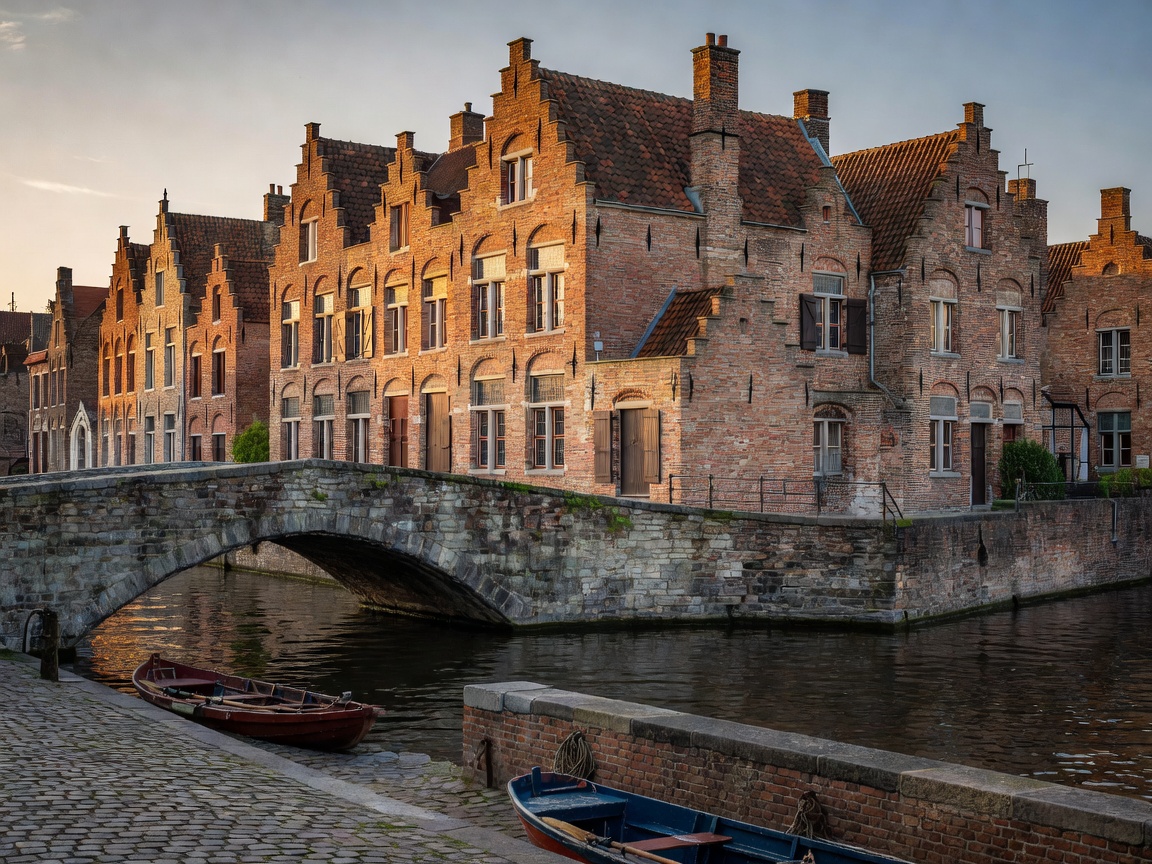 Canal in Bruges Flanders with medieval brick gables and stone bridge
