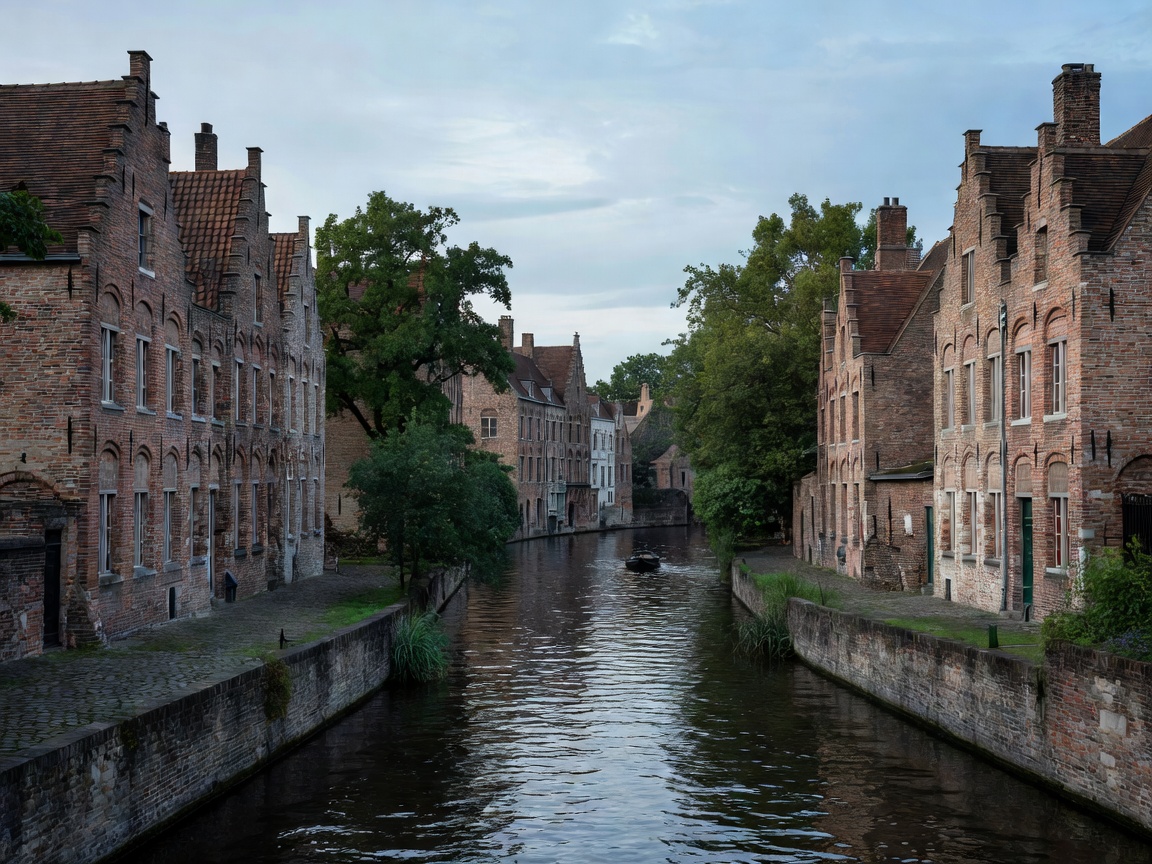 Scenic canal in Bruges Flanders lined with medieval brick houses